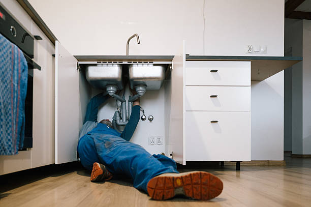 Professional Plumbing technician working in Sharpes, FL